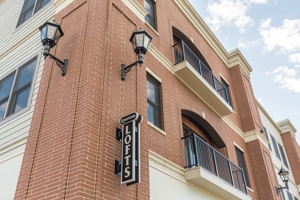 a brick building with a sign on the side of it