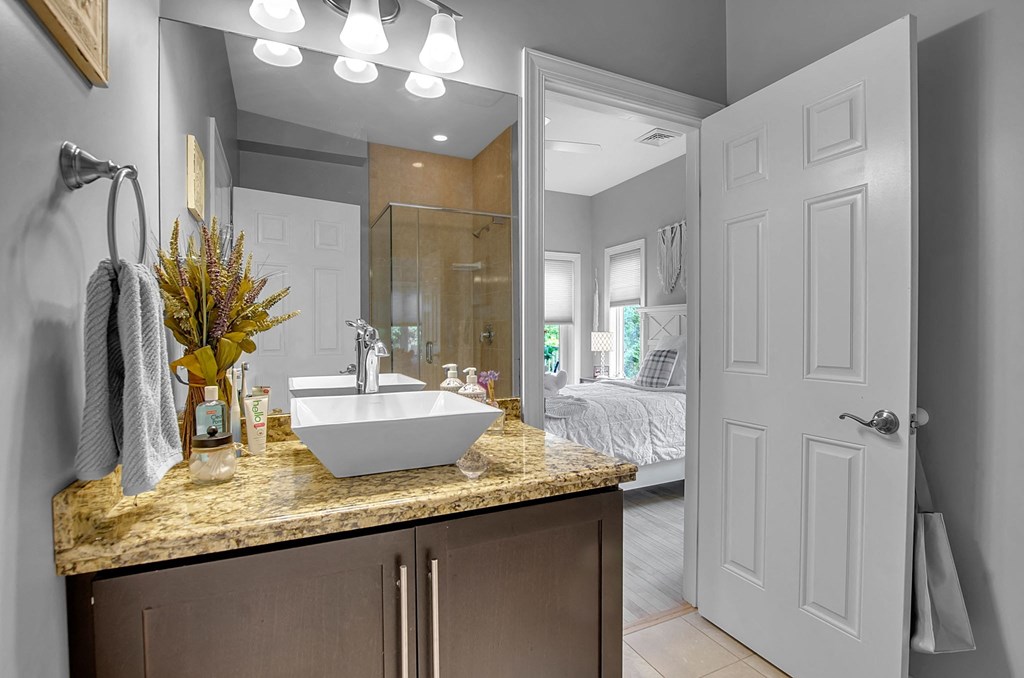 a bathroom with a sink and a mirror