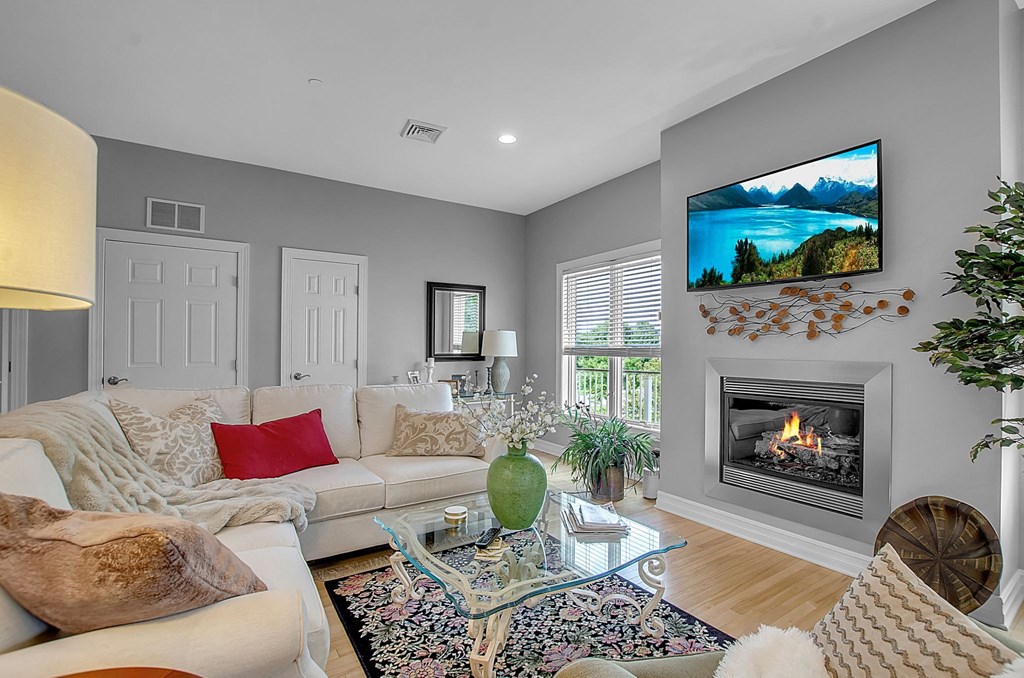 a living room with a couch and a fireplace