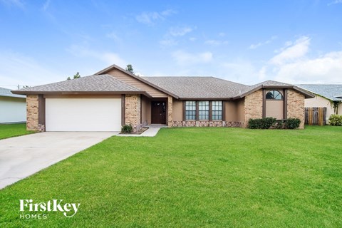 a house with a lawn in front of it