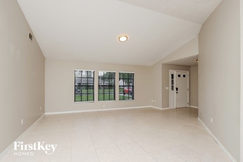 the spacious living room and dining room are spacious and clean