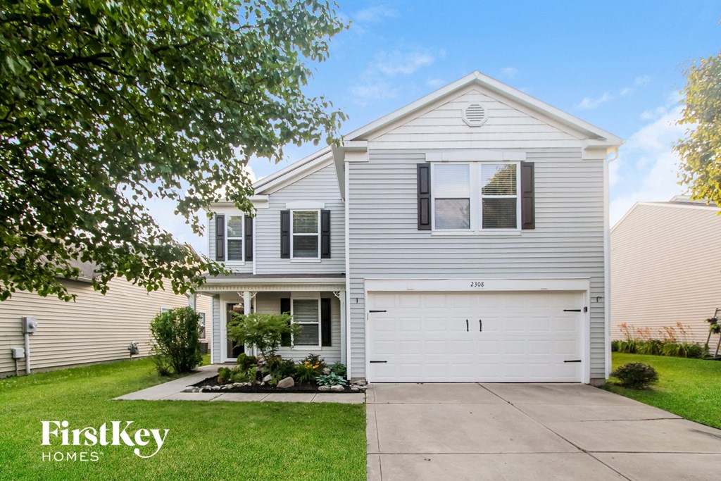 a white house with a white garage door