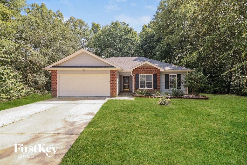 A house with a garage is for sale by FirstKey Homes.