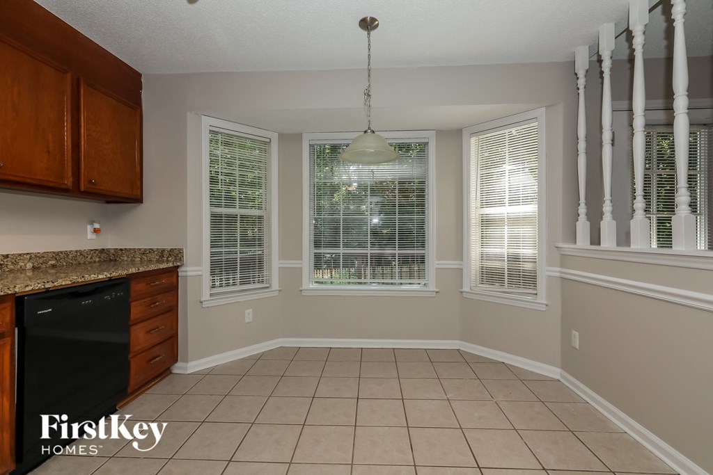A kitchen with a FirstKey Homes logo.
