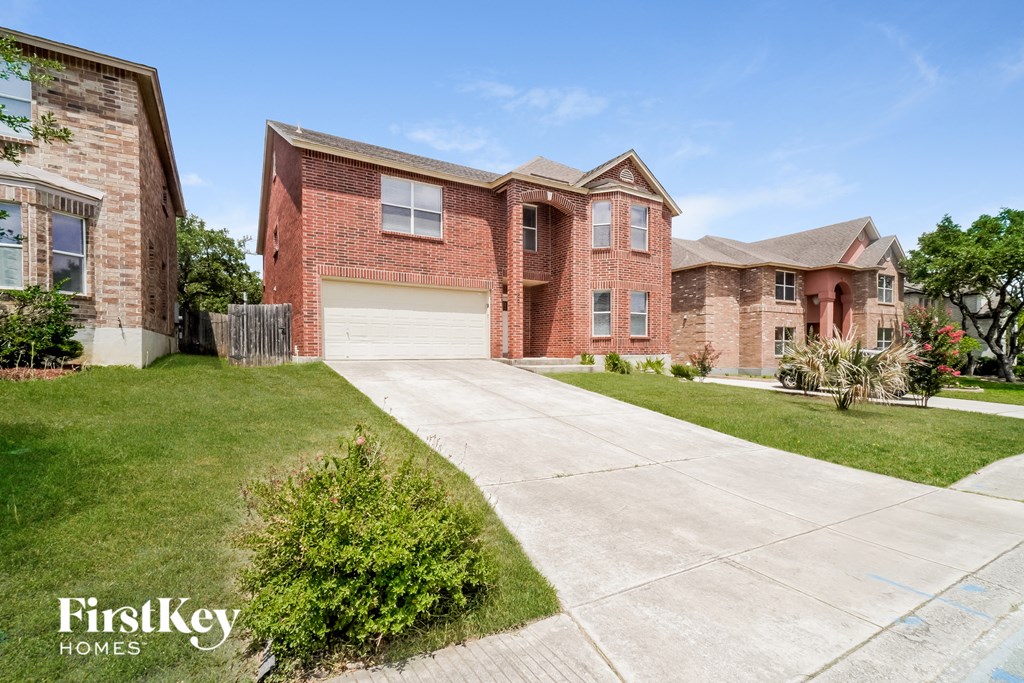 a large brick house with a white garage door