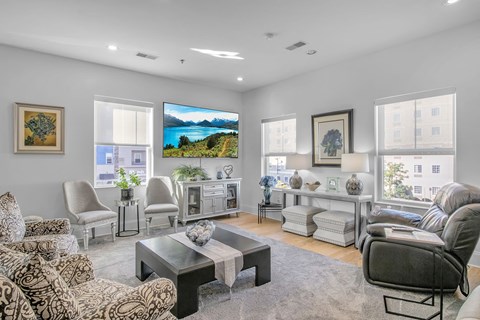 a living room with couches and chairs and a coffee table