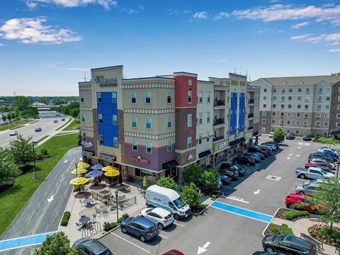 an aerial view of the residence inn in a parking lot with cars