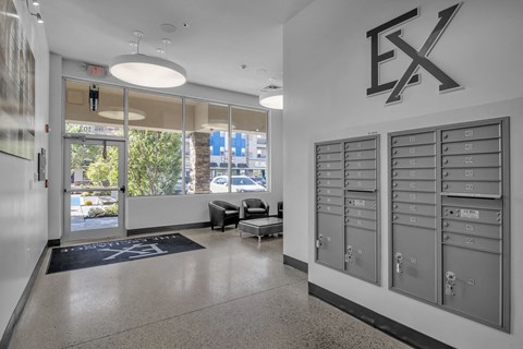 the lockers in the lobby of a building with a view of the street