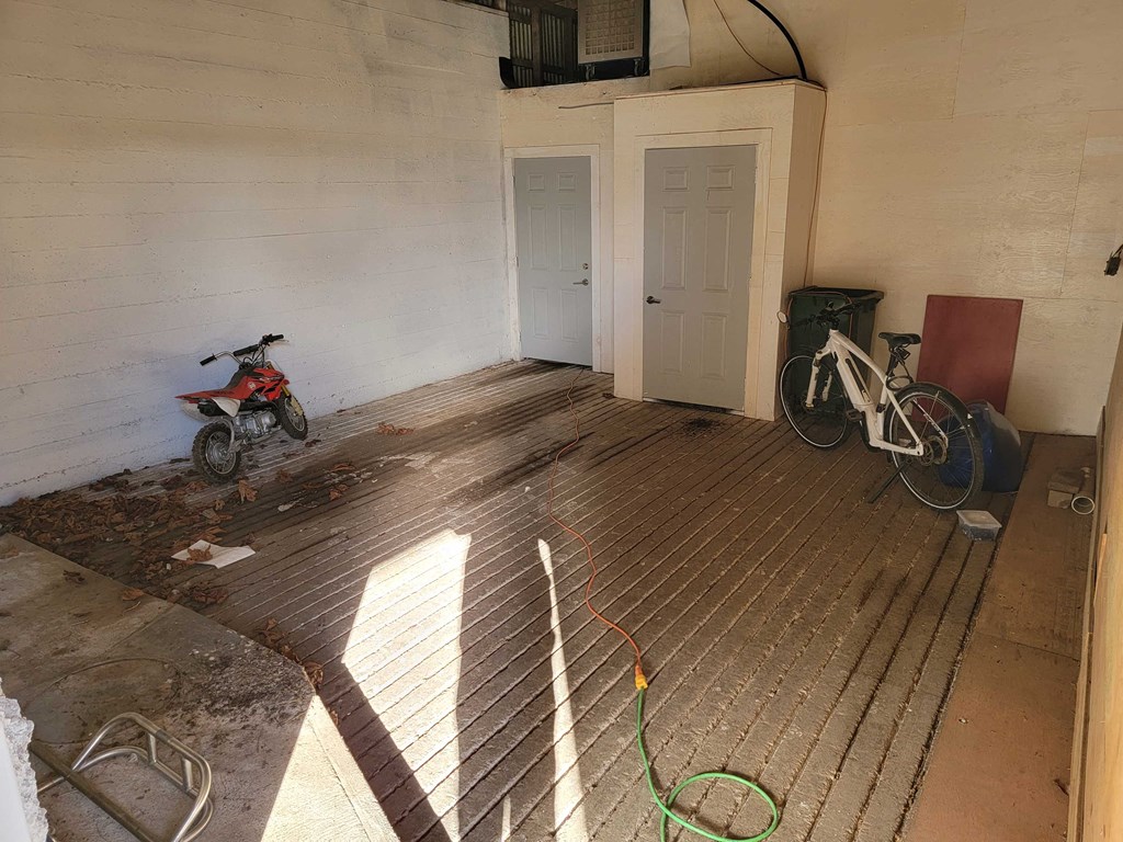 a room with a motorcycle and a bike in it