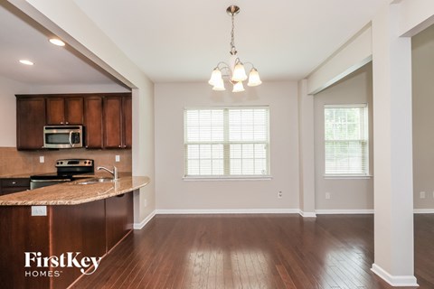 A kitchen with wooden cabinets and a countertop is shown.