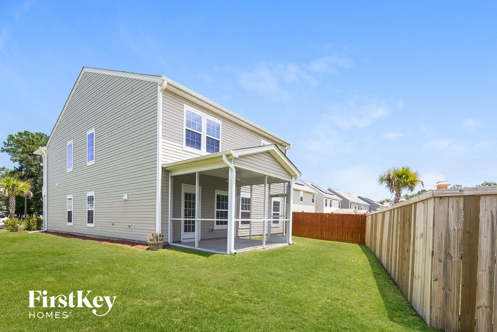 a with a yard and a wooden fence