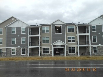 an apartment building on the side of a street