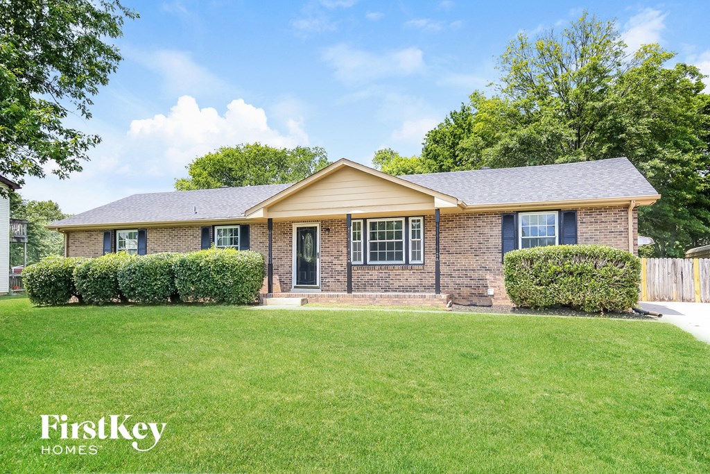 A house with a lawn in front of it.