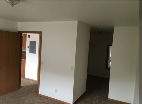 A room with a door and a window.