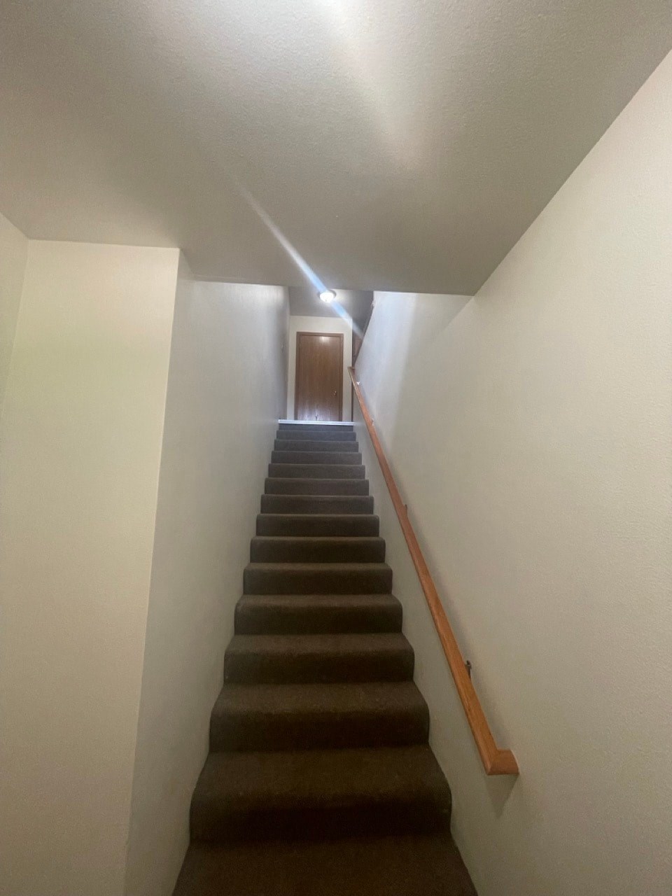 the stairs leading up to the attic in a home