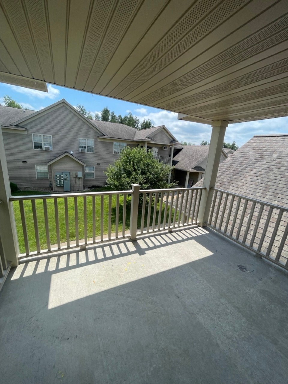 a view of a house from a porch with a roof