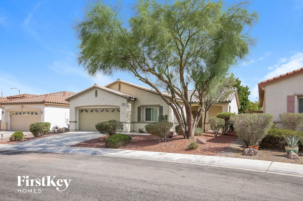 A house with a tree in front of it.