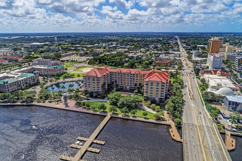 A cityscape with a large body of water and a bridge.