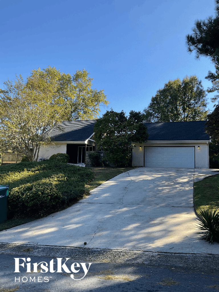 a house with a driveway and a garage door
