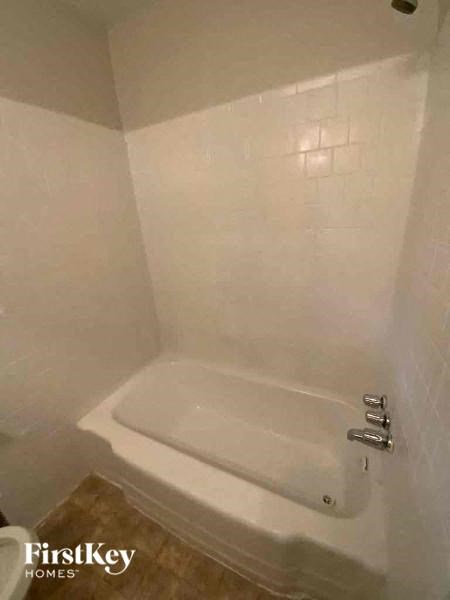 a small bathroom with a shower and a toilet