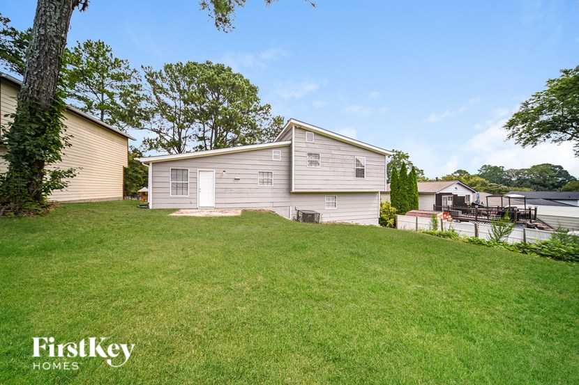 A house with a lawn in front of it.