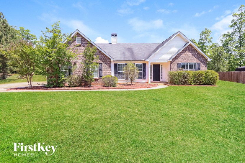 a home with a large yard and grass