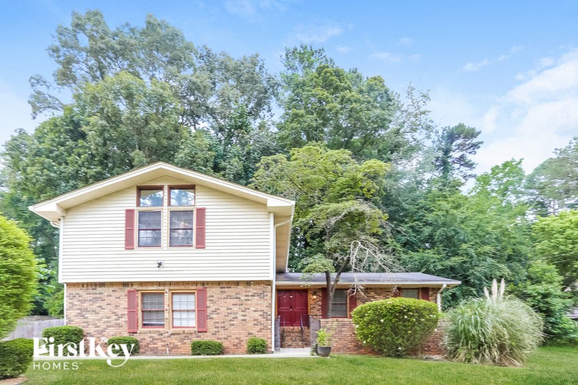 a small brick and with a red door