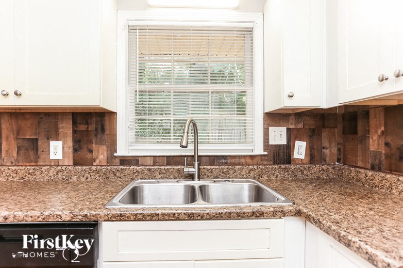 a kitchen with a sink and a window