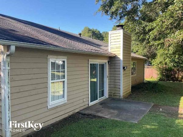 a small house with a patio and a door