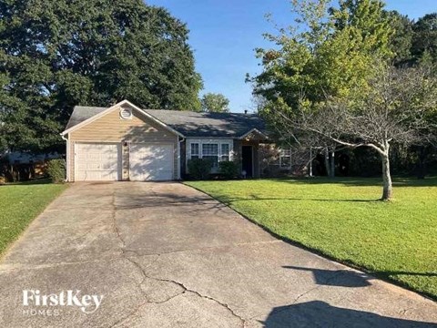 a house with a driveway and a garage door