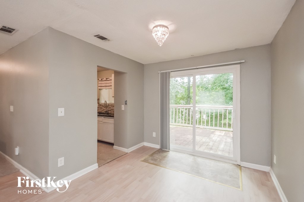 the living room is open to the dining room and kitchen