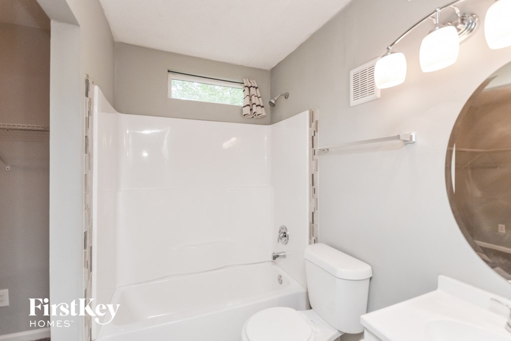 a small bathroom with a toilet and a shower