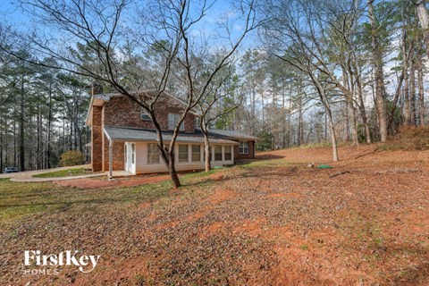 a small house in the middle of the woods