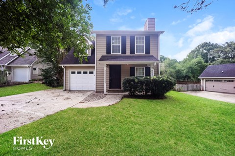 A house with a garage is for sale by FirstKey Homes.