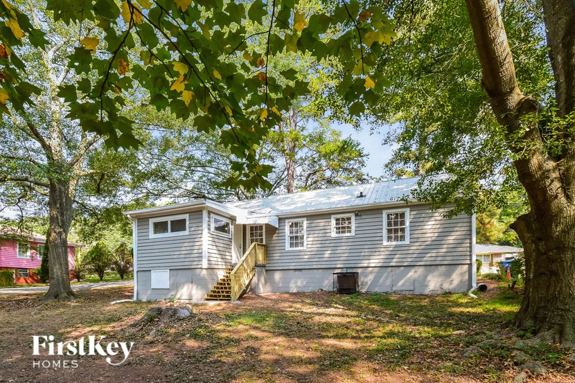 a blue and on a hill with trees