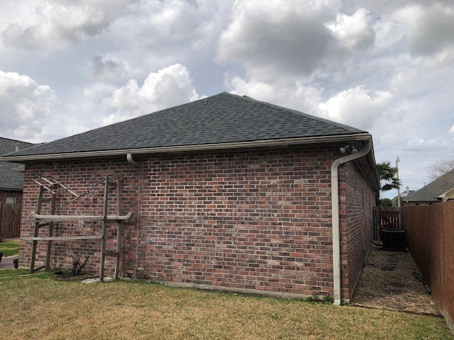 a brick building with a hose on the side of it