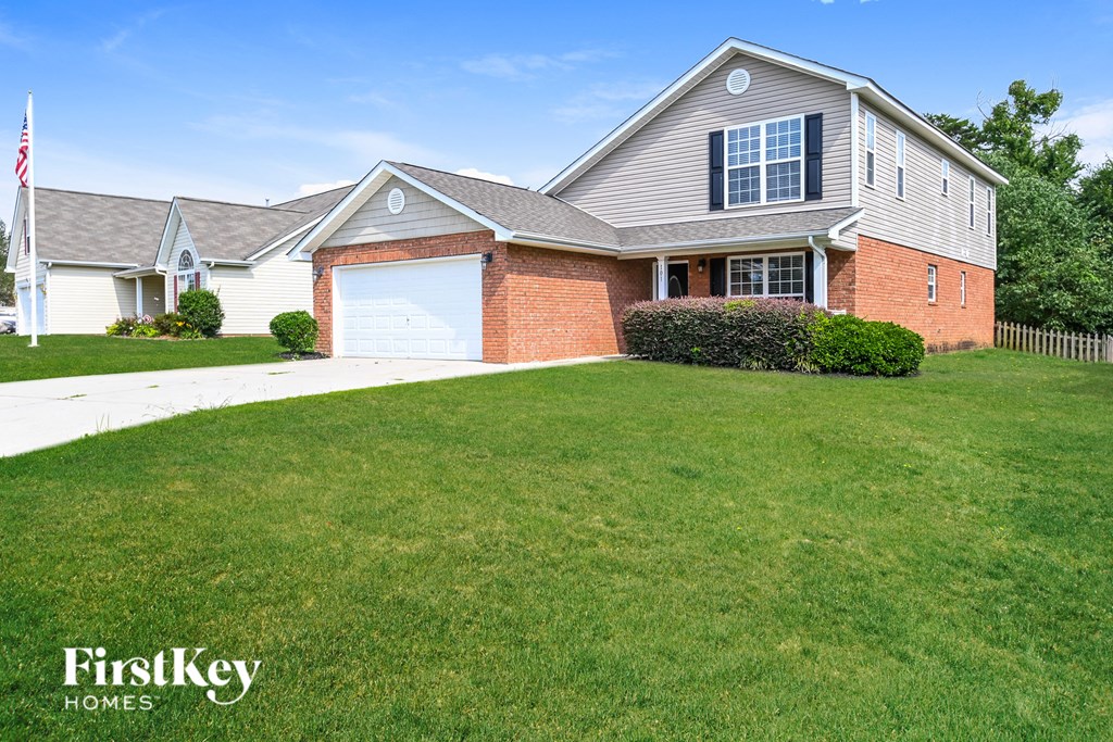 a home with a lawn in front of it