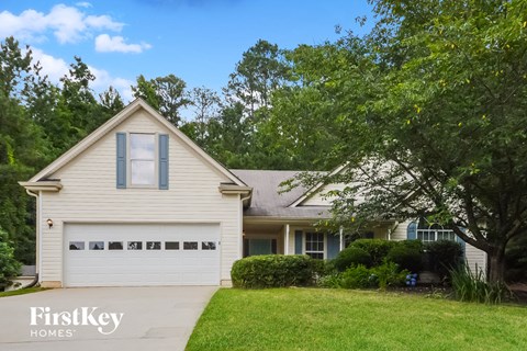 a white house with a white garage door