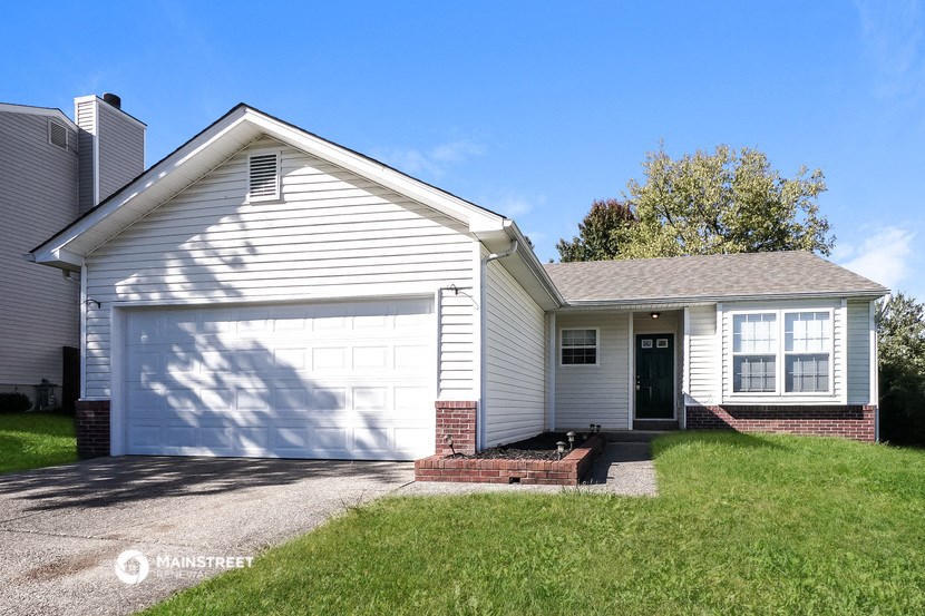 a white house with a white garage door