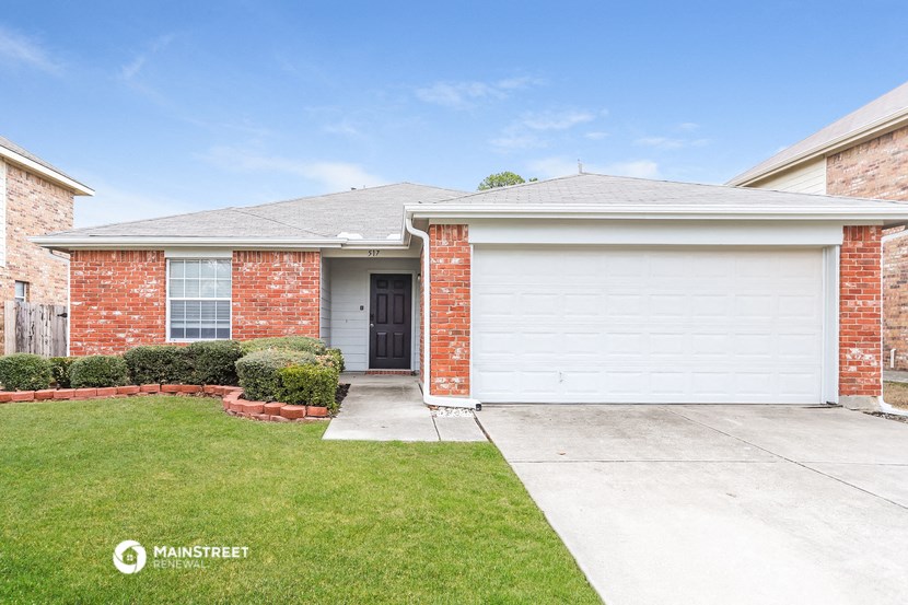 a brick house with a white garage door