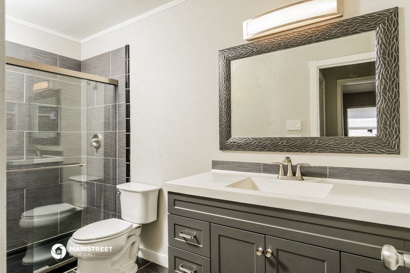 a bathroom with a sink toilet and a shower