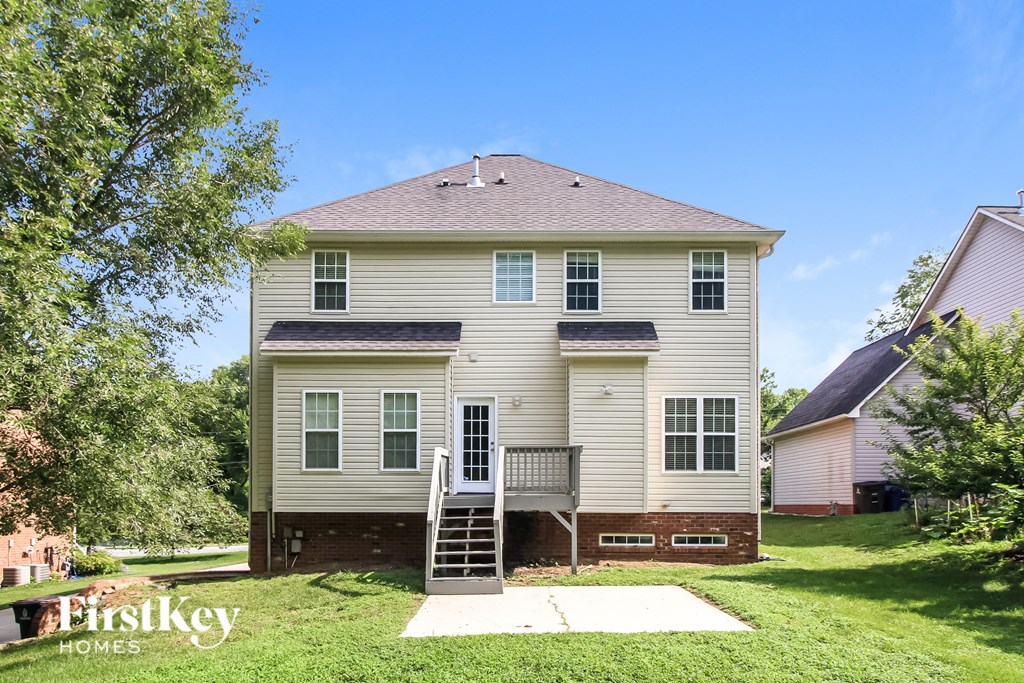 a white house with a ladder in front of it