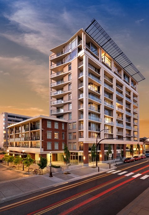 a rendering of an apartment building on a city street. #victoria #rentals #affordable #apartments