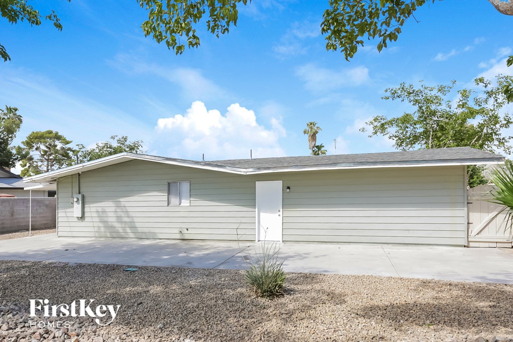 a small white house with a white garage door
