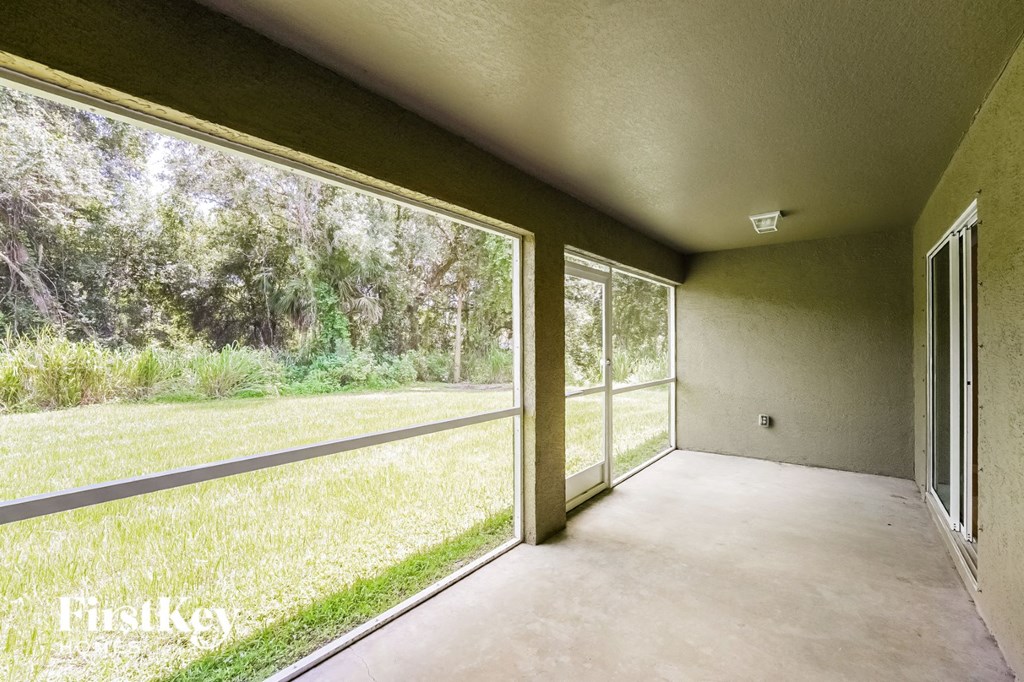 a room with a large window on the side of a house