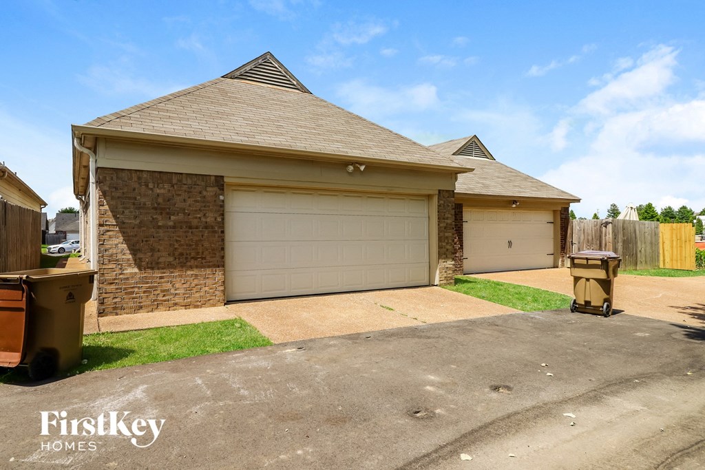 a house with a driveway and a garage door
