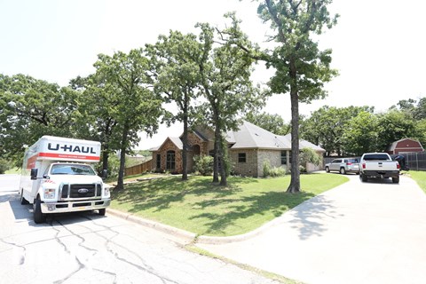 a truck is parked in front of a house