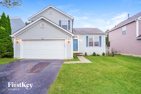 A house with a garage is for sale by FirstKey Homes.