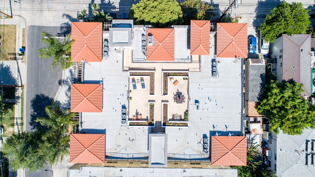 arial view of the roof of a building with people on it