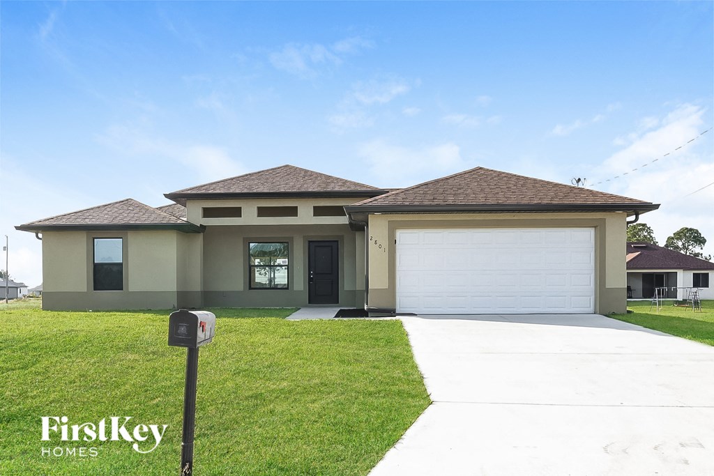 a house with a driveway and a garage door